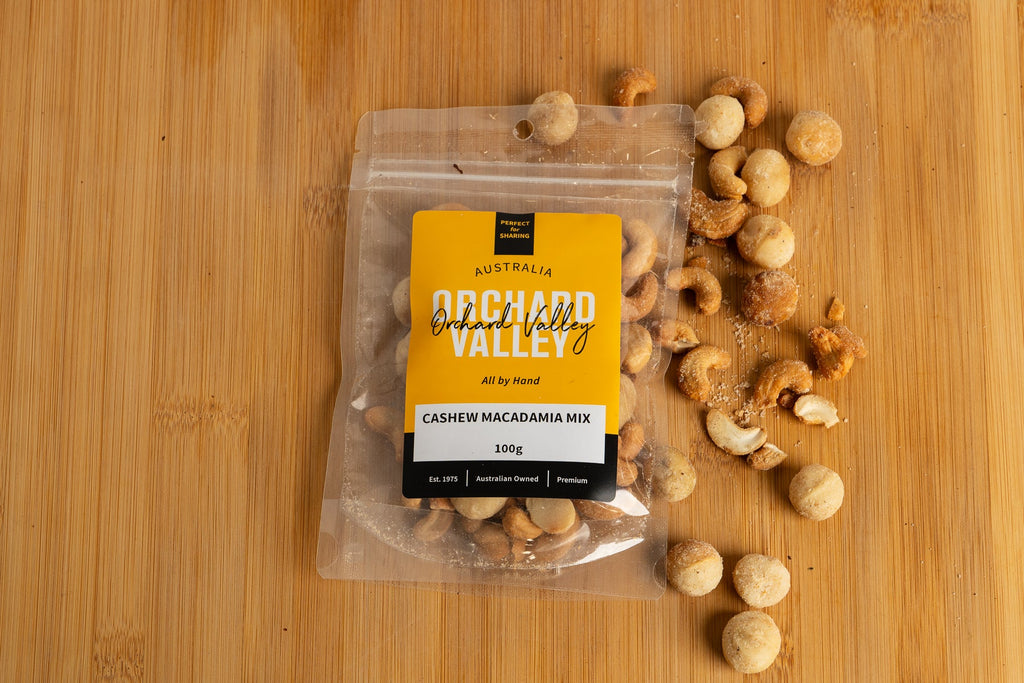 Orchard Valley Cashew Macadamia Mix 100g tub — buttery macadamias and creamy cashews lightly salted